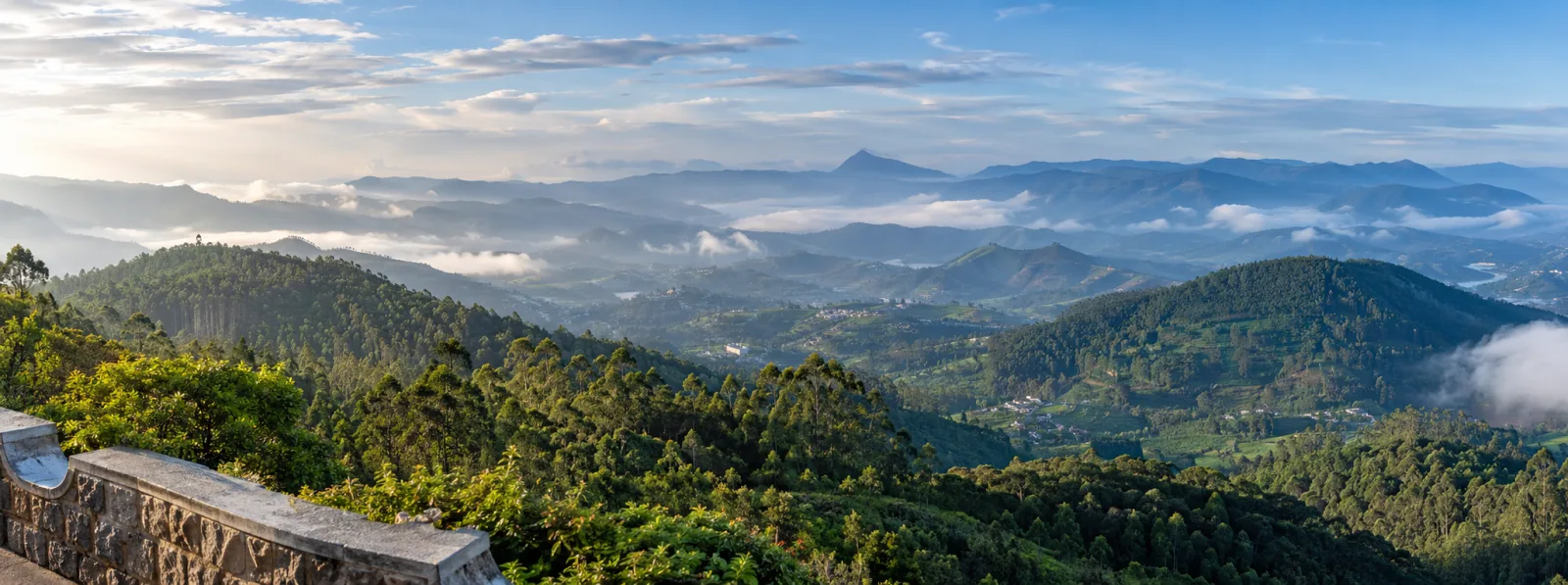 Photorealistic panoramic view of the layered Nilgiri hills from Doddabetta Peak