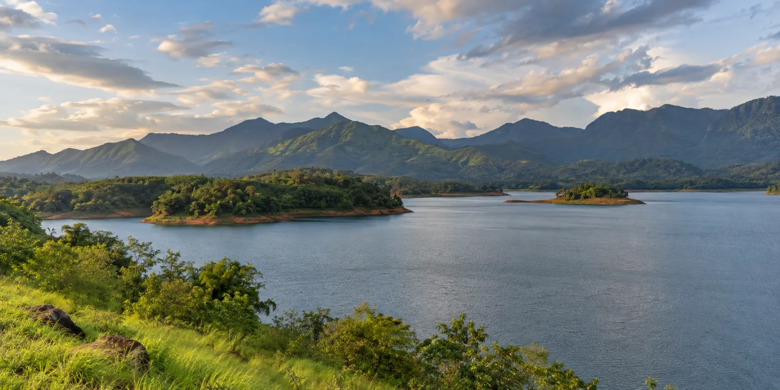Photorealistic panoramic view of Banasura Sagar reservoir and green Wayanad hills
